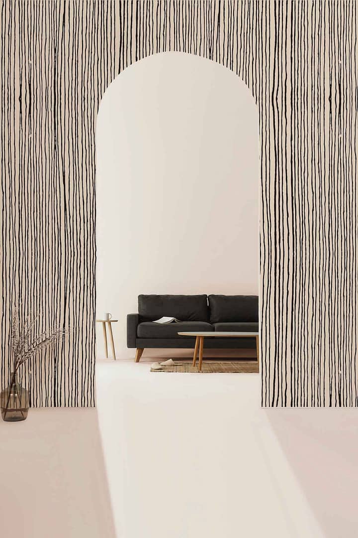 Artistic Freedom - a wallpaper made up of vertical hand sketched lines in black on a solid background by Cara Saven Wall Design